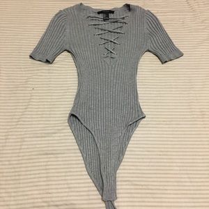 Grey body suit